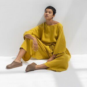 Black Crane Pea Jumpsuit in Gold